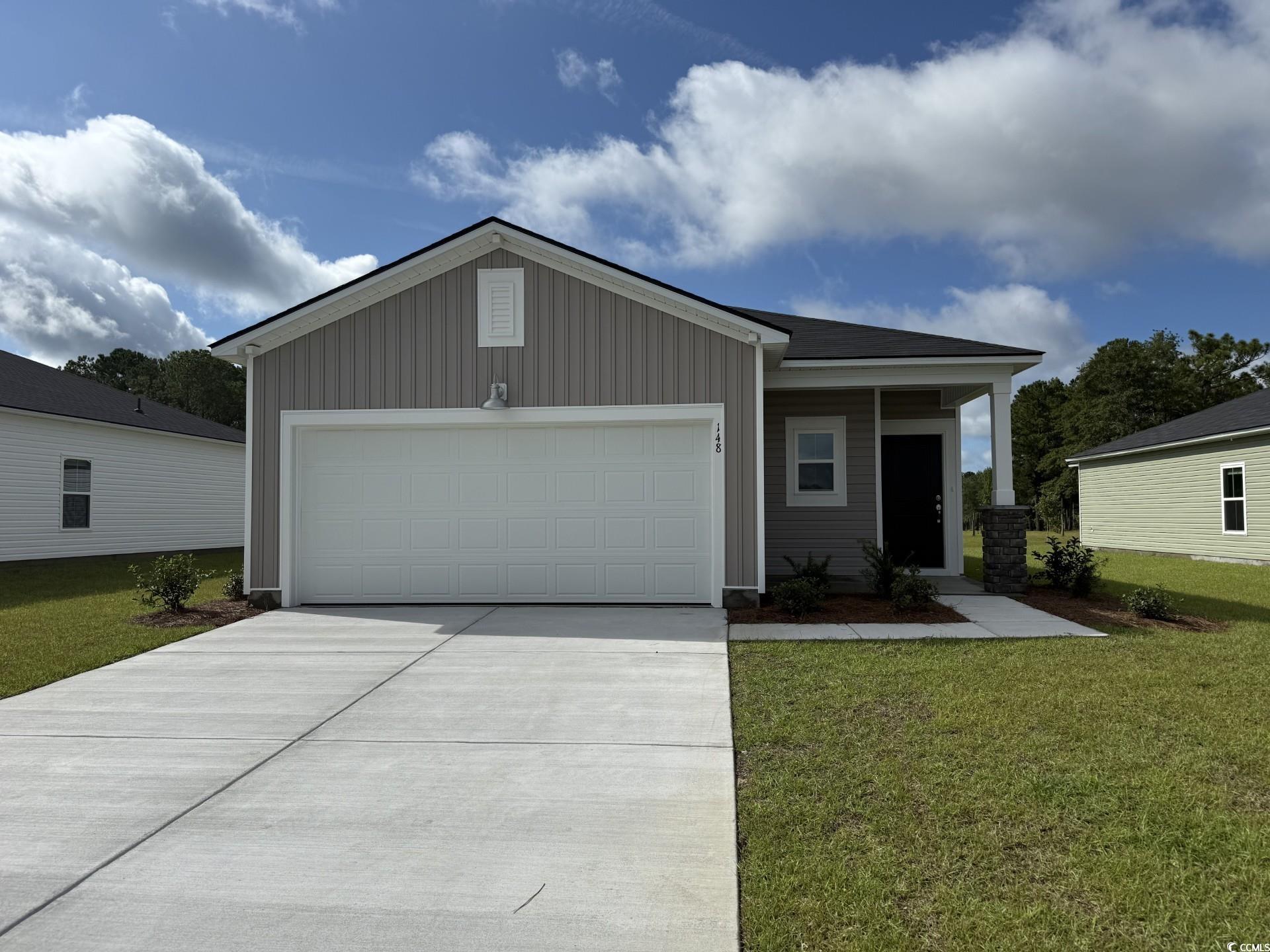 148 Warner Xing Way Loris, SC 29569 - Photo 1 of 11 View of front of house featuring a garage, a front