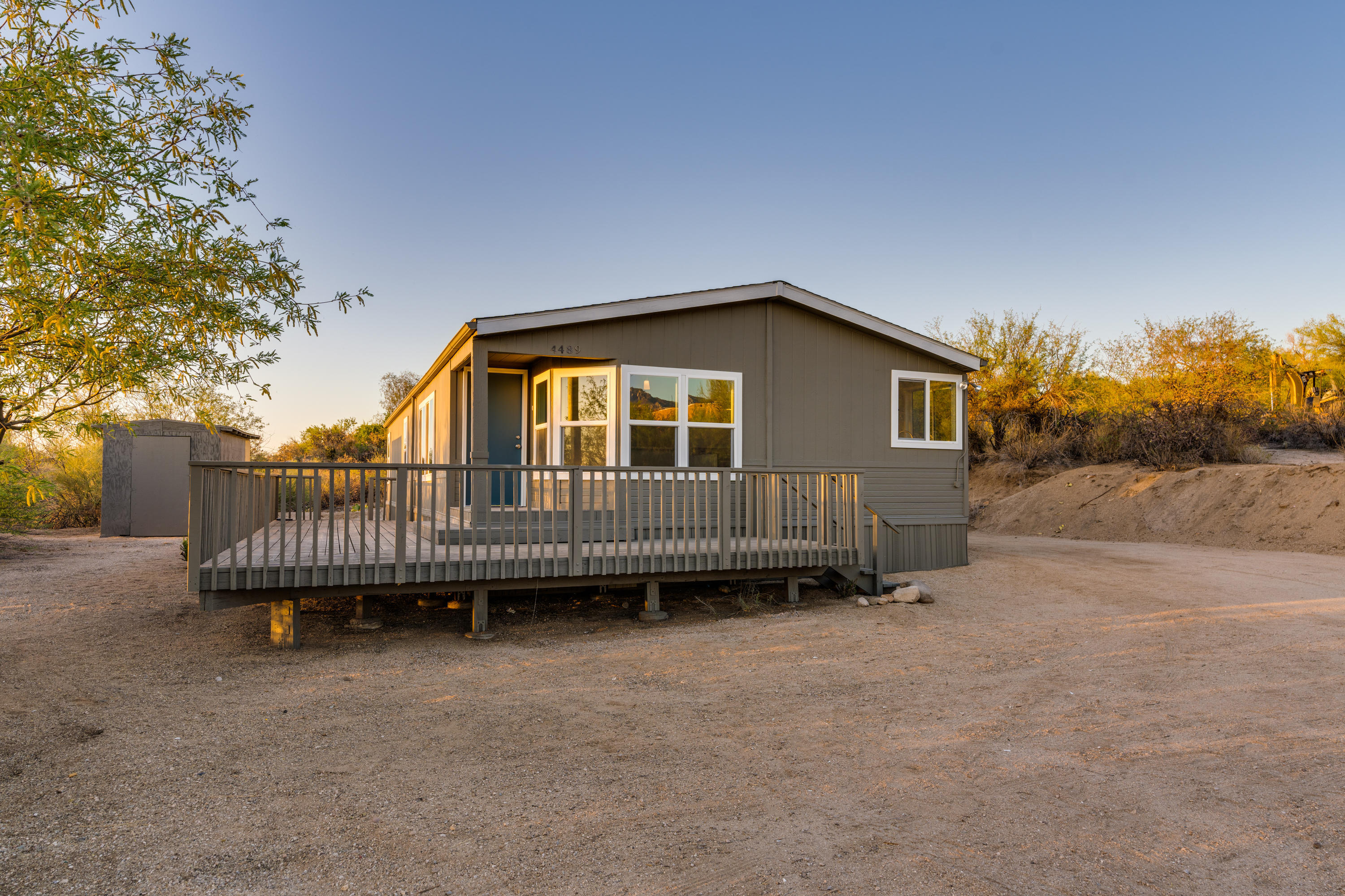 4489 East Wilds Road Tucson, AZ 85739 - Photo 47 of 50 a view of a house with a backyard and a patio