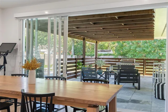 a view of a dining room with furniture window and outside view