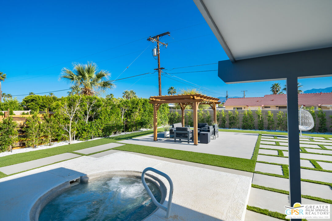 2775 East Verona Road Palm Springs, CA 92262 - Photo 21 of 73 a view of a patio with a table chairs