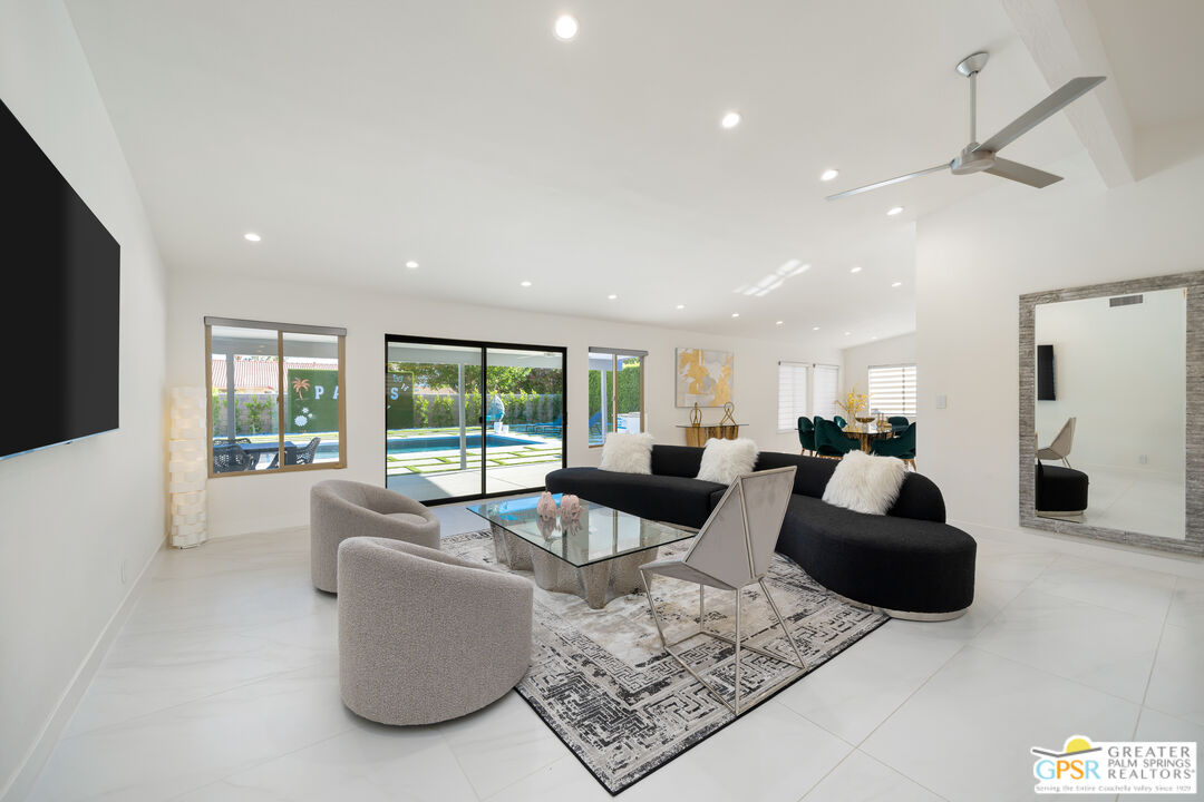 2775 East Verona Road Palm Springs, CA 92262 - Photo 27 of 73 a living room with furniture and a large window