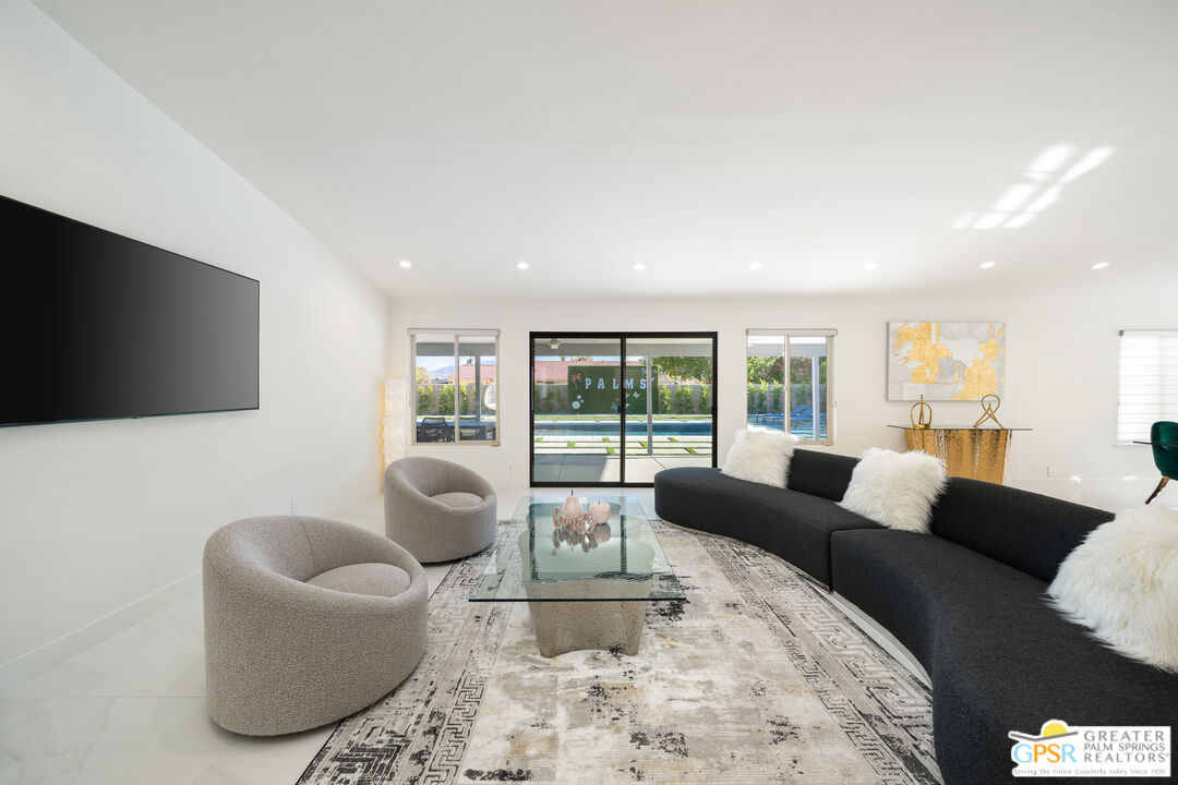 2775 East Verona Road Palm Springs, CA 92262 - Photo 28 of 73 a living room with furniture and a flat screen tv