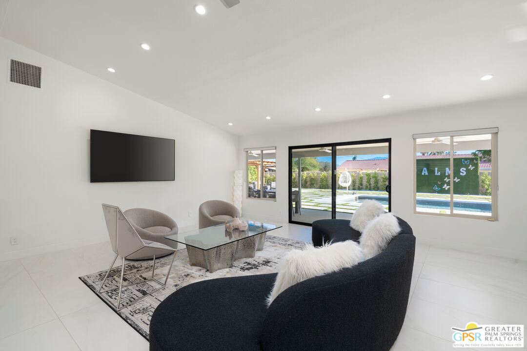 2775 East Verona Road Palm Springs, CA 92262 - Photo 29 of 73 a living room with furniture and a flat screen tv