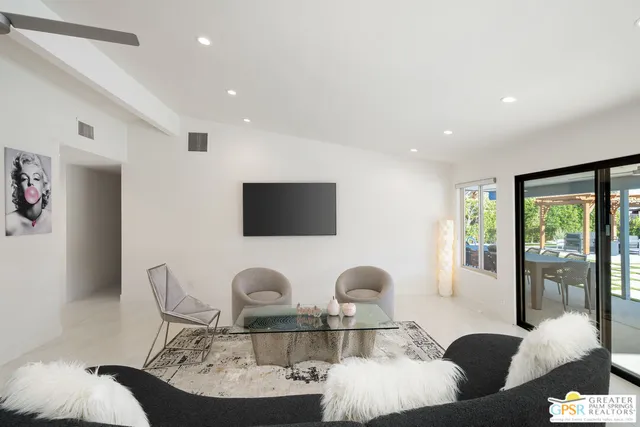 a kitchen with white cabinets and refrigerator