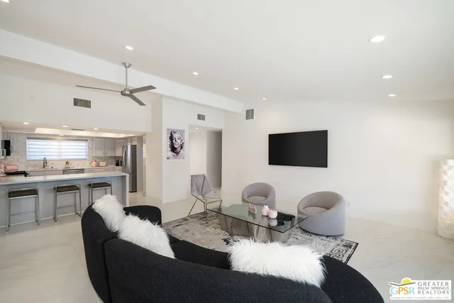 a kitchen with white cabinets stainless steel appliances and sink