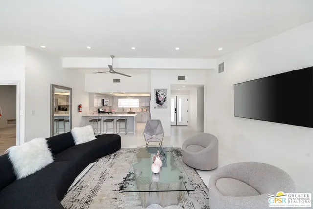 a view of a dining room with furniture and window