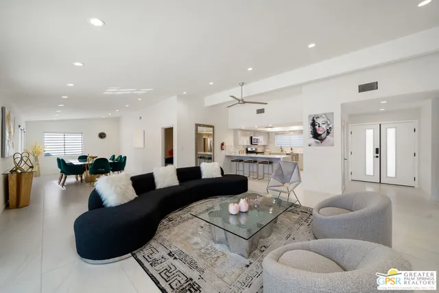 a dining room with furniture and window