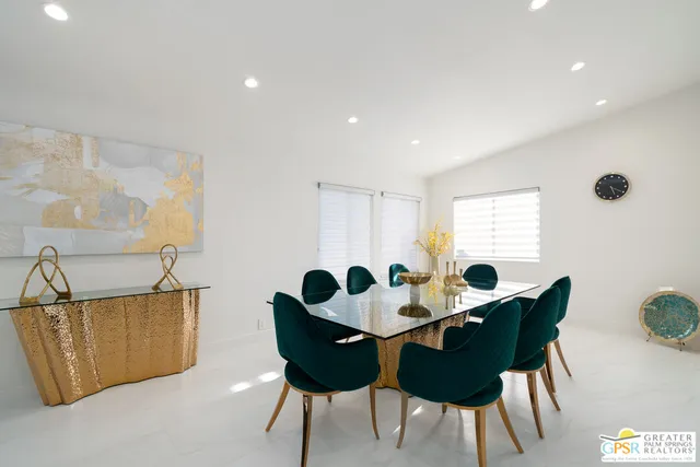 a bedroom with a bed lamp and a window