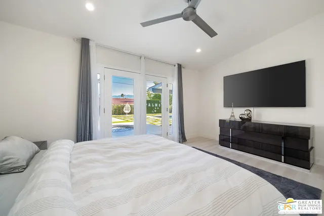 a porch with a table and chairs