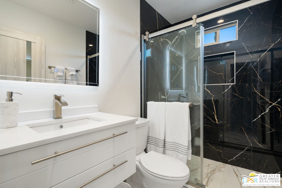 2775 East Verona Road Palm Springs, CA 92262 - Photo 47 of 73 a bathroom with a sink toilet vanity and shower