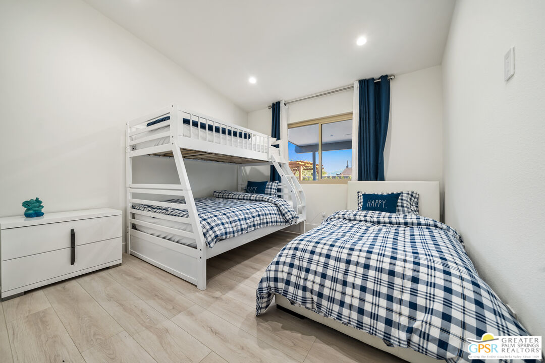 2775 East Verona Road Palm Springs, CA 92262 - Photo 51 of 73 a bedroom with a bed lamp and a window