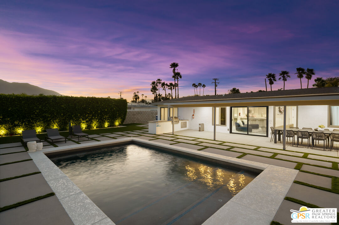 2775 East Verona Road Palm Springs, CA 92262 - Photo 61 of 73 a view of a swimming pool with a lounge chairs