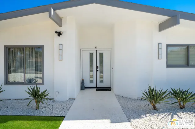 a view of a house with swimming pool