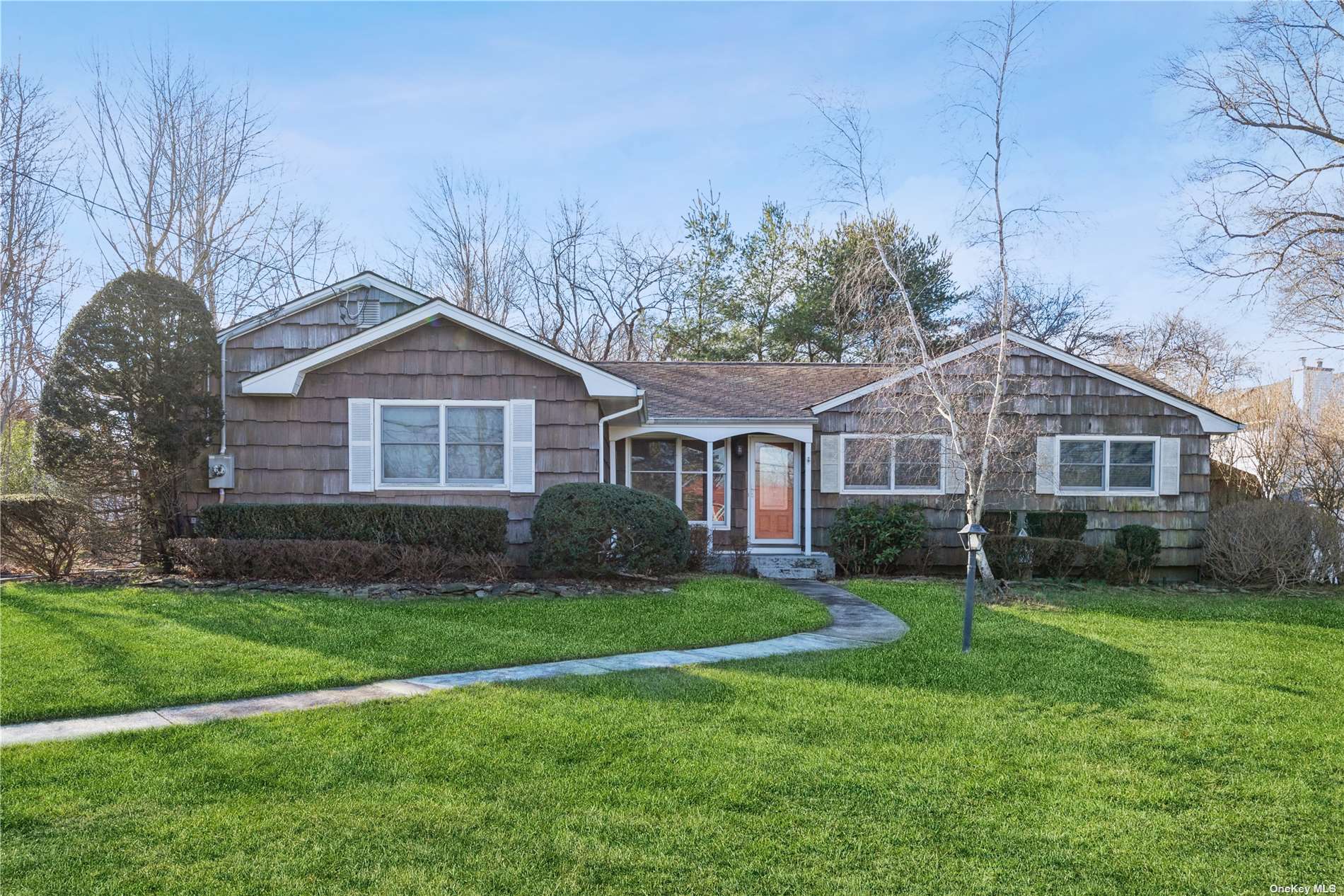 40 Sams Path Rocky Point, NY 11778 - Photo 1 of 1 a front view of a house with a garden