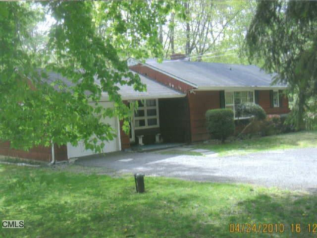 21 Old Washington Road Ridgefield, CT 06877 - Photo 1 of 1 a backyard of a house with seating area