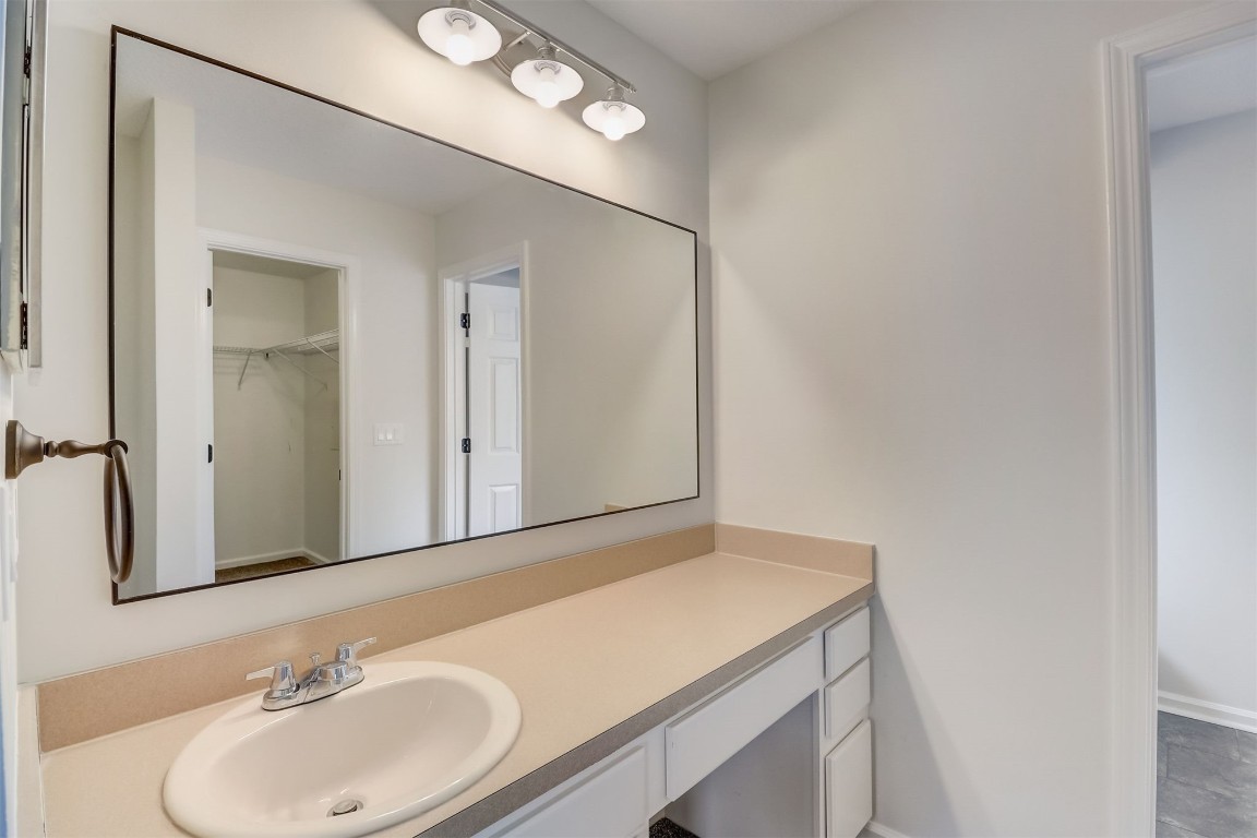 96099 Starlight Lane Yulee, FL 32097 - Photo 15 of 36 a bathroom with a sink and a mirror