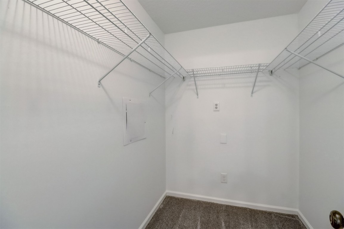 96099 Starlight Lane Yulee, FL 32097 - Photo 16 of 36 a view of a room with racks on the wall