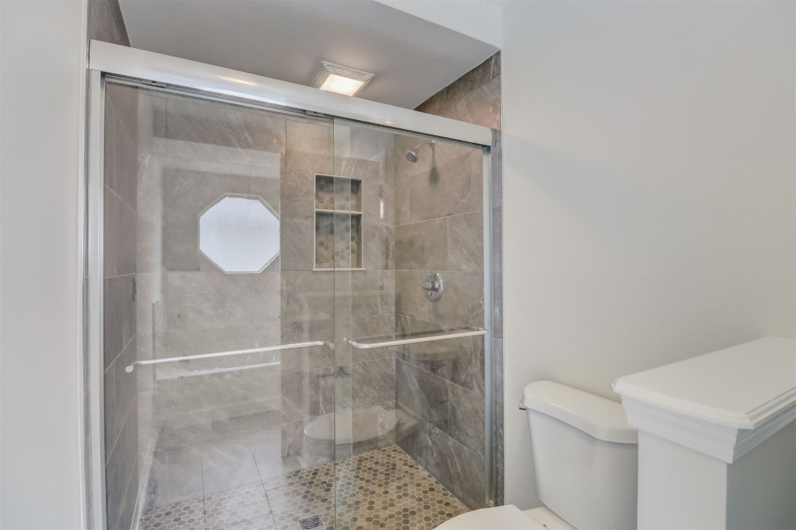 96099 Starlight Lane Yulee, FL 32097 - Photo 18 of 36 a bathroom with a shower and toilet