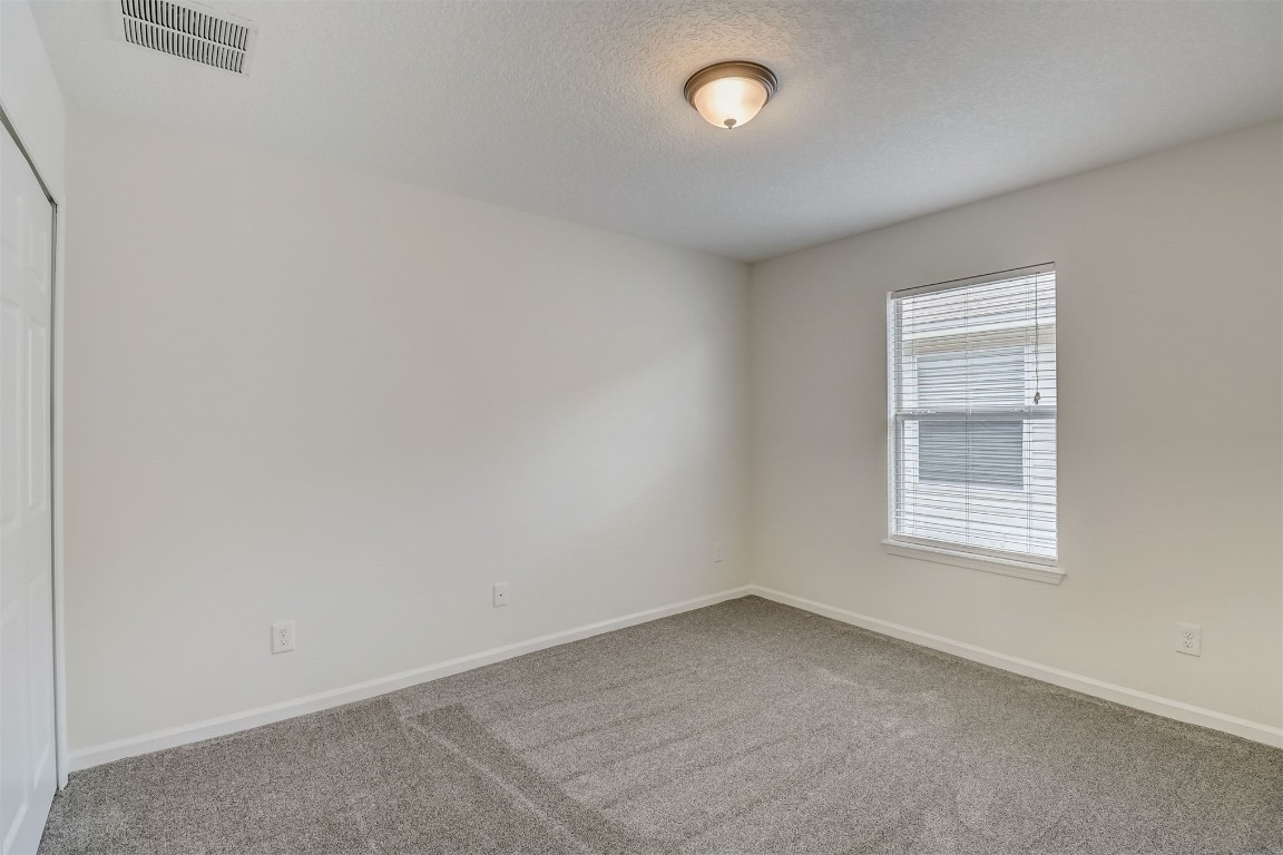 96099 Starlight Lane Yulee, FL 32097 - Photo 21 of 36 an empty room with a window