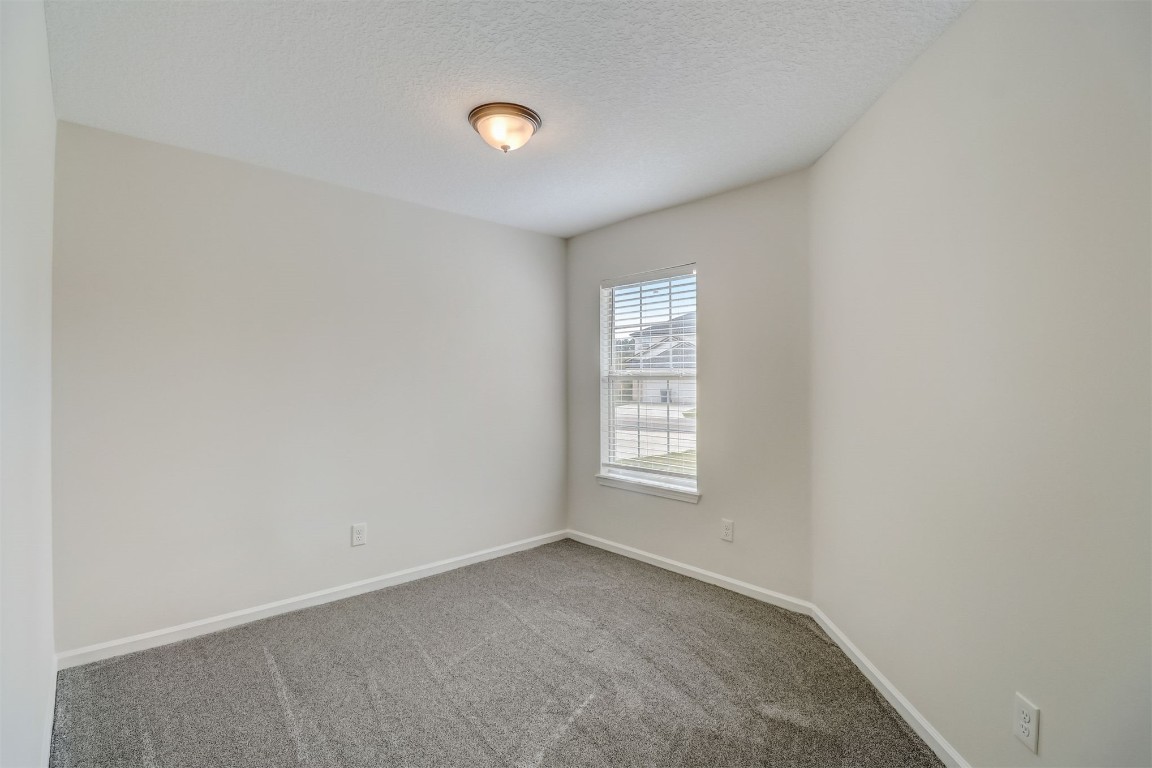 96099 Starlight Lane Yulee, FL 32097 - Photo 24 of 36 an empty room with windows