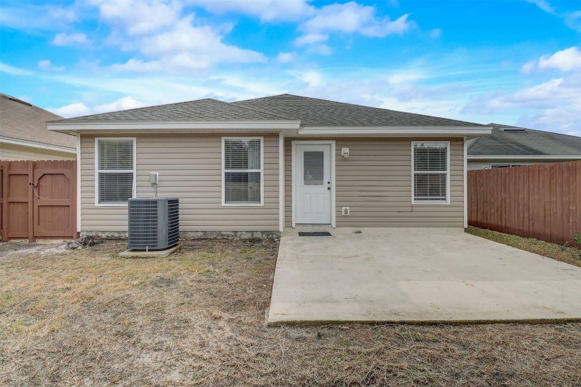 96099 Starlight Lane Yulee, FL 32097 - Photo 29 of 36 a view of a house with a yard