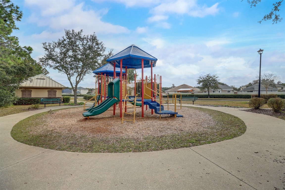 96099 Starlight Lane Yulee, FL 32097 - Photo 34 of 36 a view of a house with basketball court