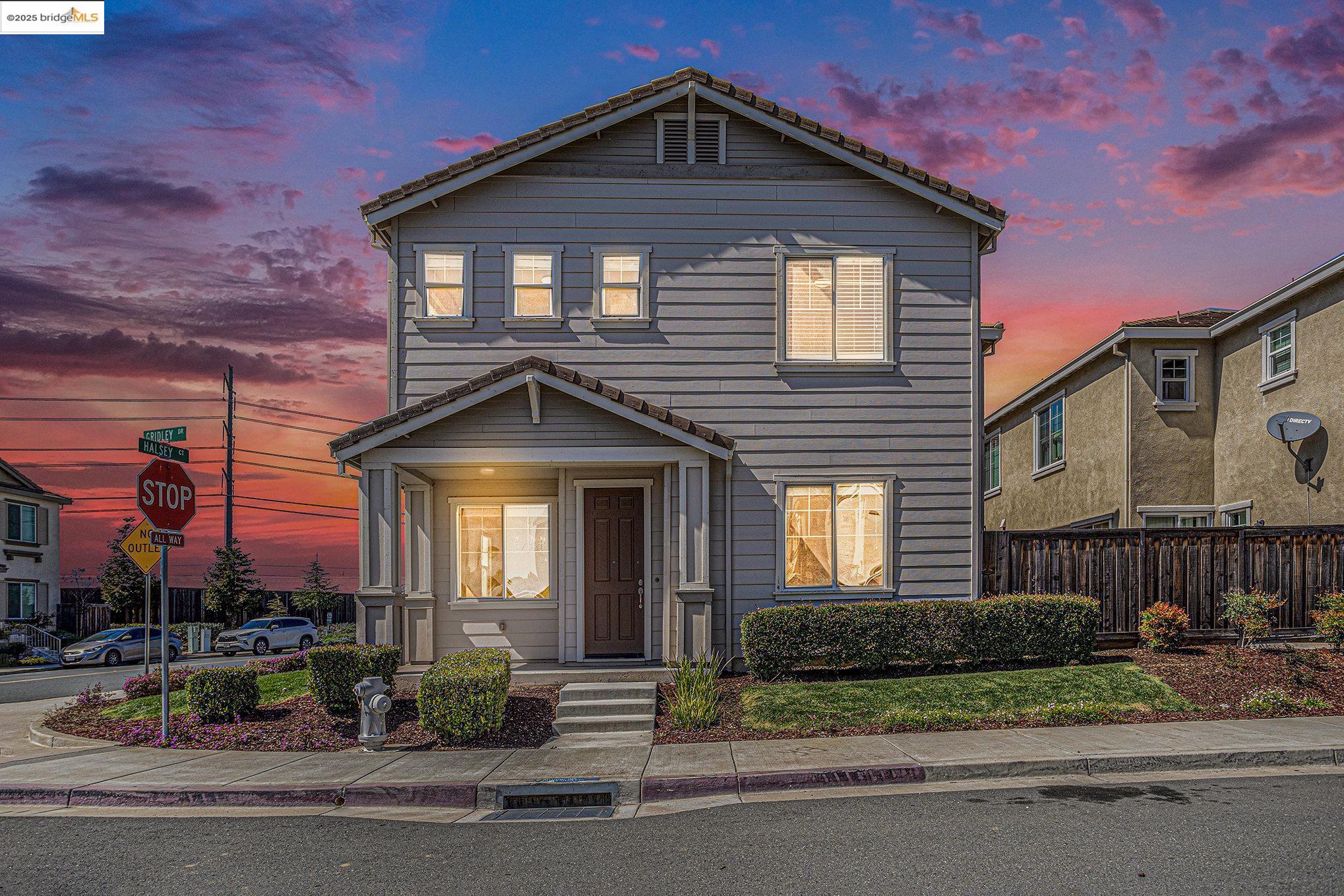 a front view of a house with a yard