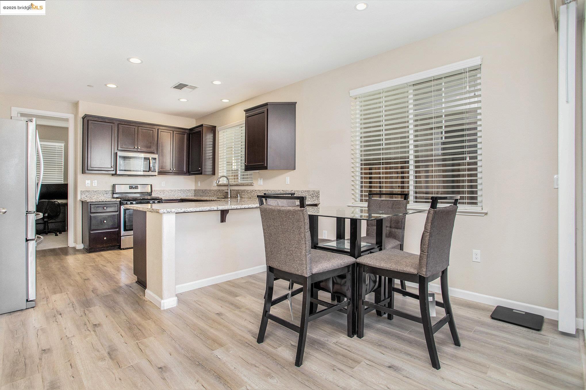 175 Halsey Way Pittsburg, CA 94565 - Photo 11 of 33 a dining room with furniture and wooden floor