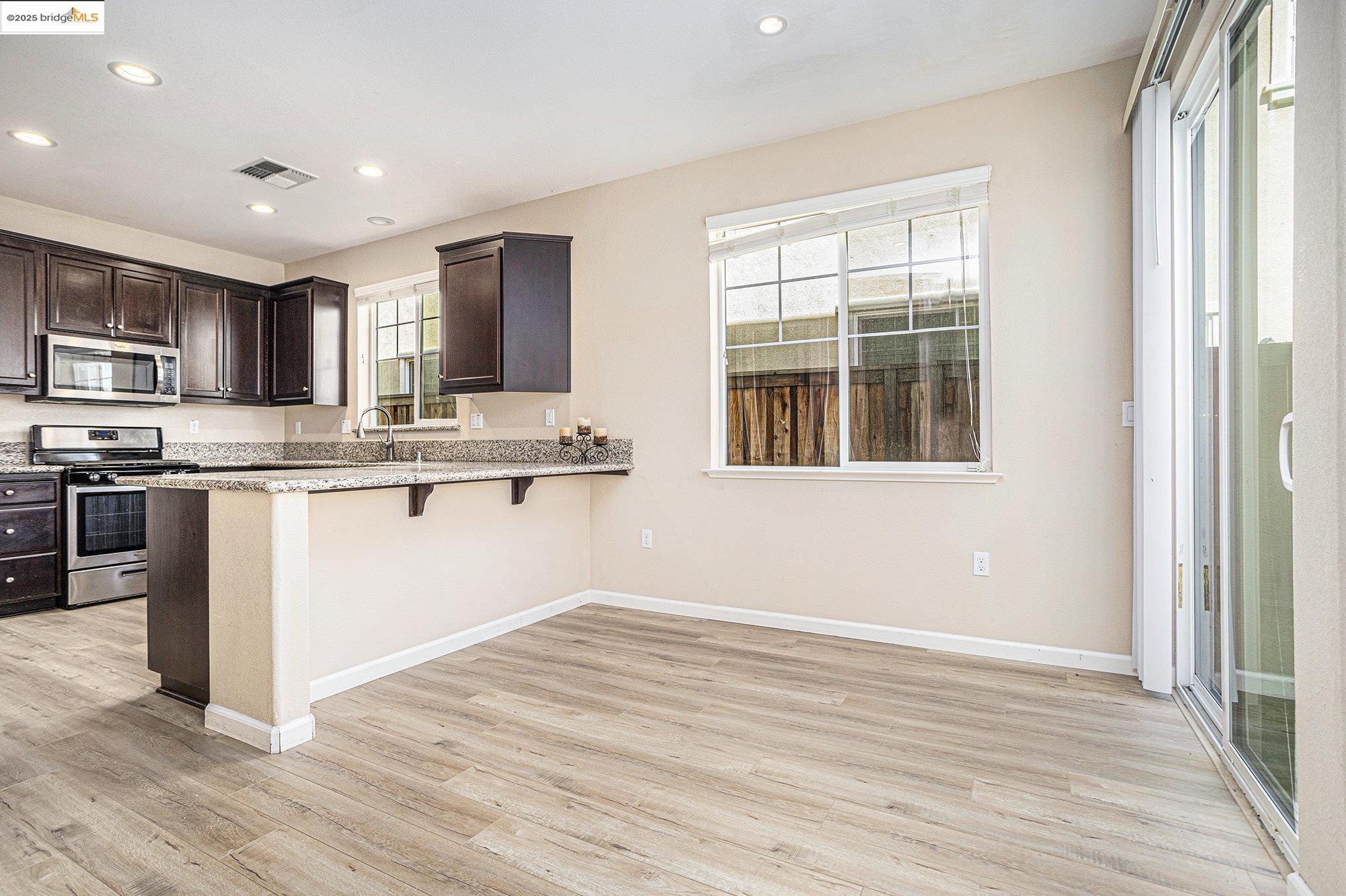 175 Halsey Way Pittsburg, CA 94565 - Photo 12 of 33 a kitchen with stainless steel appliances granite countertop a stove and a sink