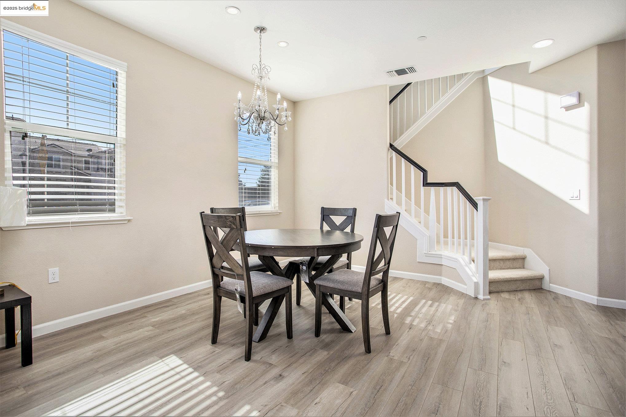 175 Halsey Way Pittsburg, CA 94565 - Photo 16 of 33 a view of a dining room with furniture window and wooden floor