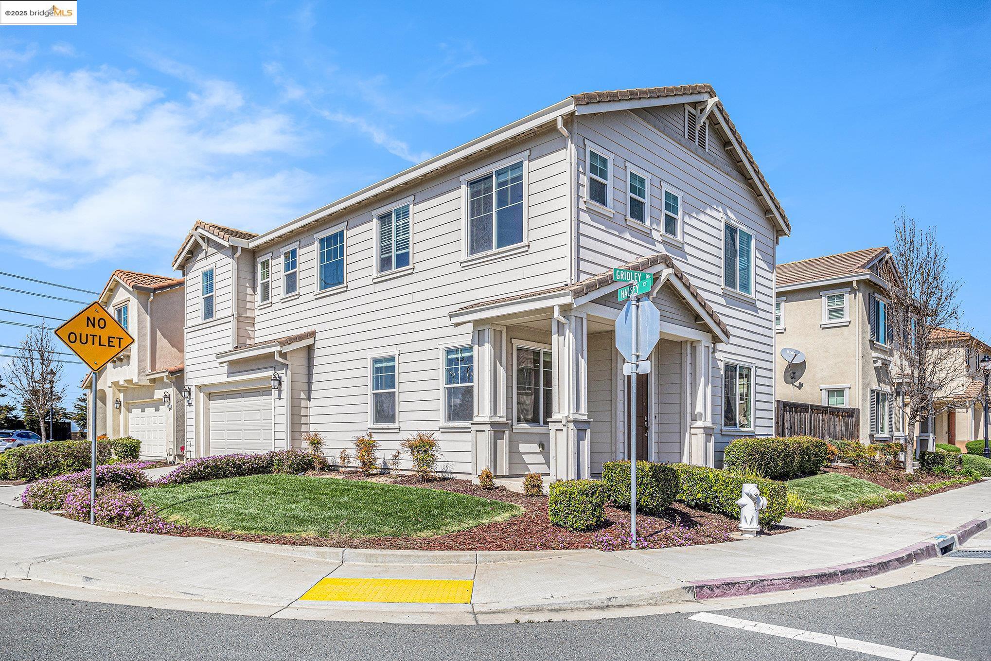 175 Halsey Way Pittsburg, CA 94565 - Photo 2 of 33 a front view of a house with a yard and potted plants