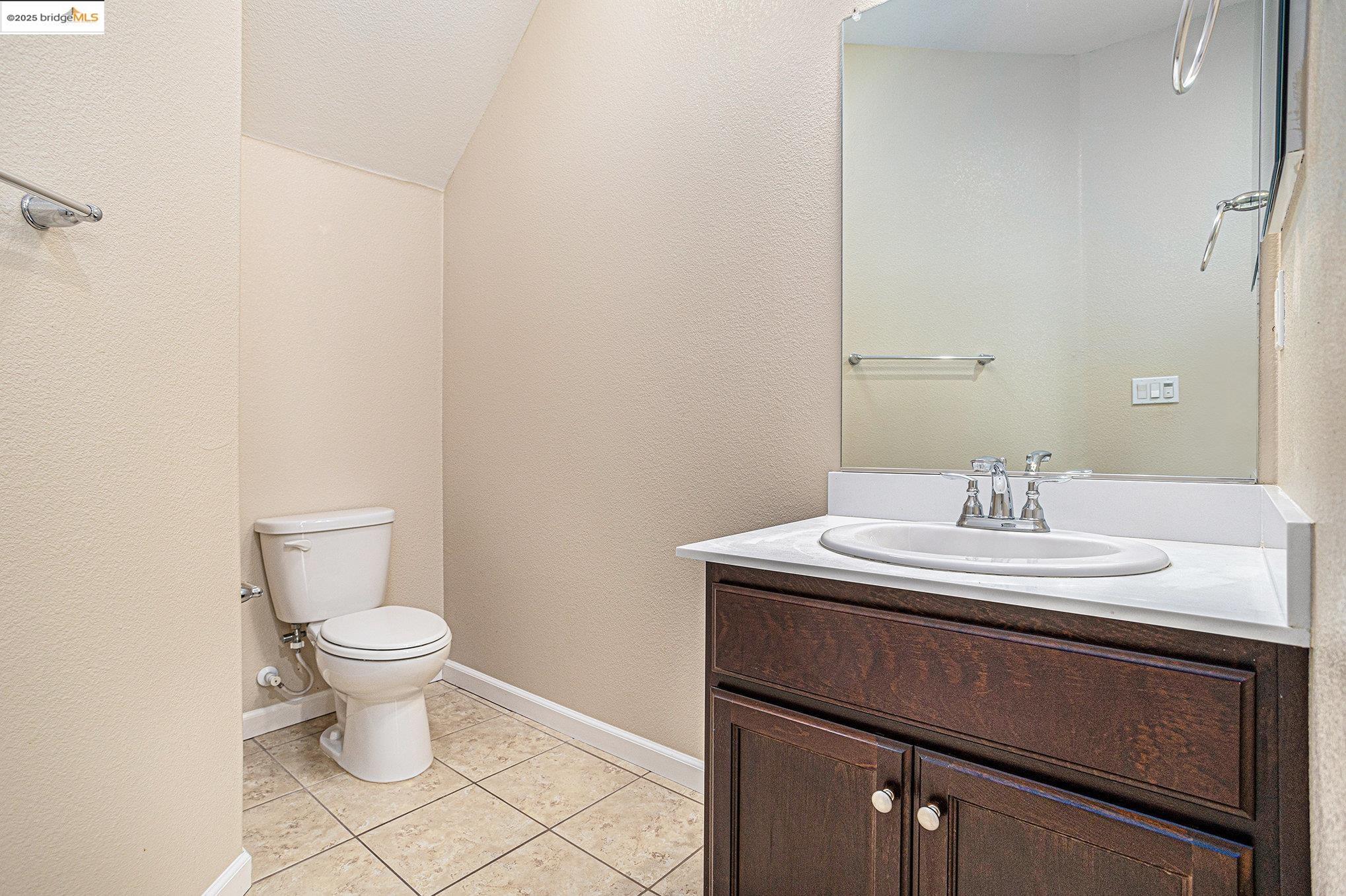 175 Halsey Way Pittsburg, CA 94565 - Photo 30 of 33 a bathroom with a sink and a toilet