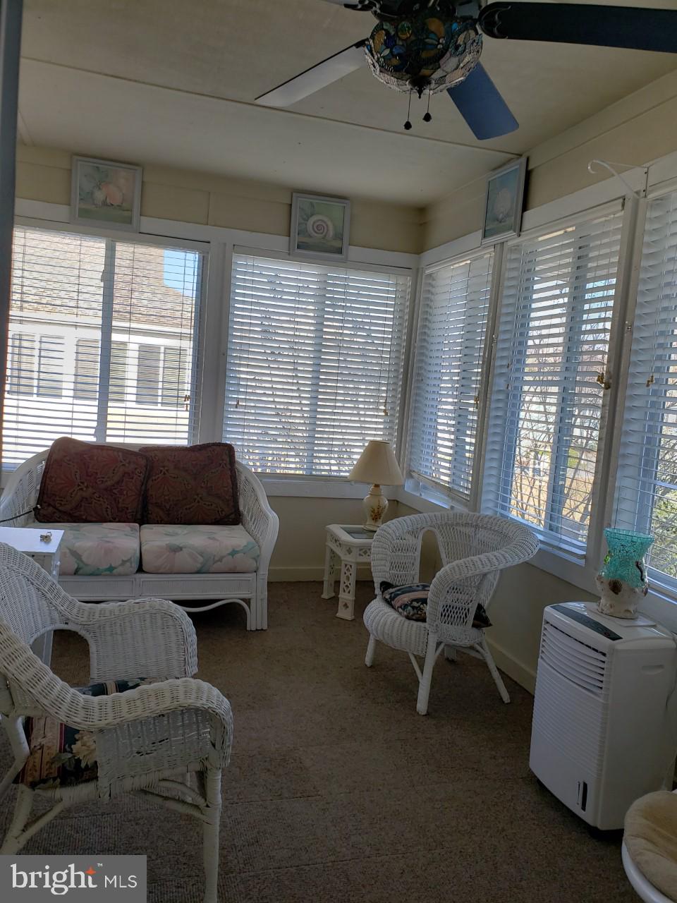 13 Pecan Court, Unit 67G Lewes, DE 19958 - Photo 13 of 25 a living room with furniture and a large window