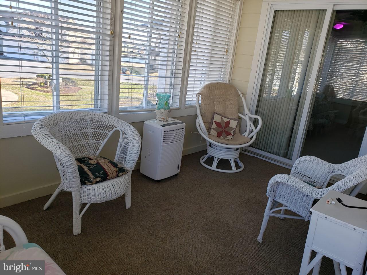 13 Pecan Court, Unit 67G Lewes, DE 19958 - Photo 14 of 25 a living room with furniture and a window