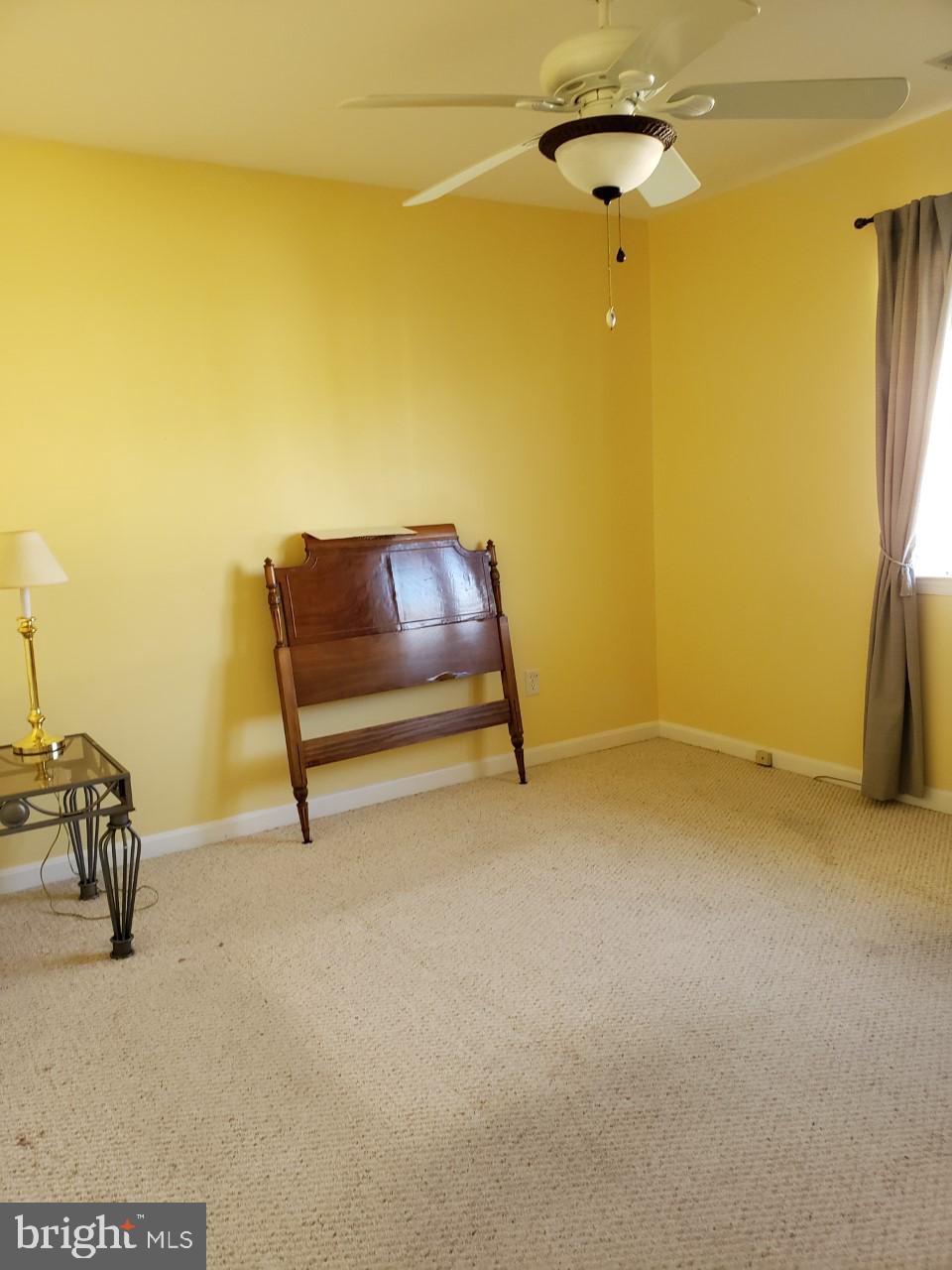 13 Pecan Court, Unit 67G Lewes, DE 19958 - Photo 20 of 25 a living room with a couch and a table