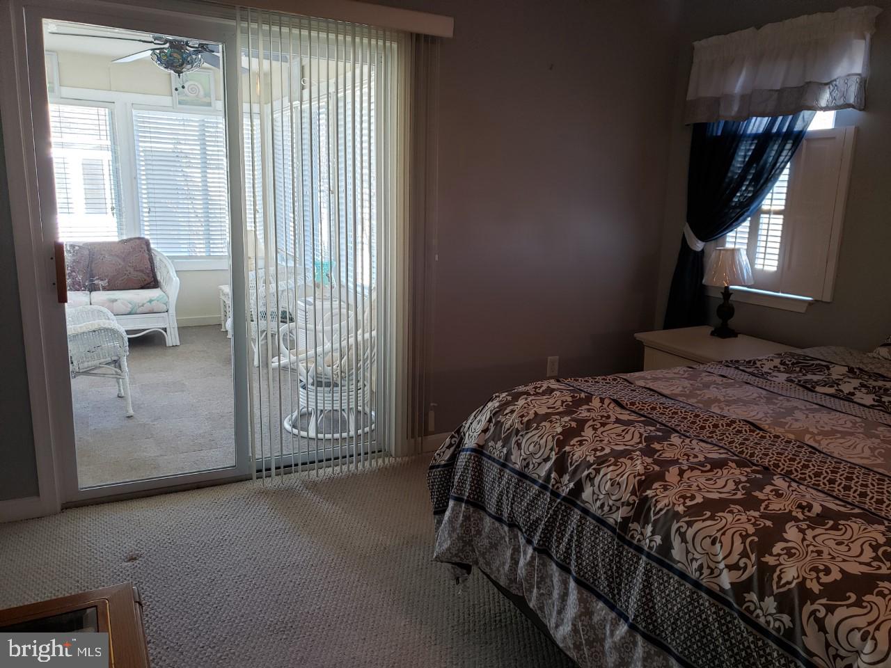 13 Pecan Court, Unit 67G Lewes, DE 19958 - Photo 8 of 25 a bedroom with a bed and a window