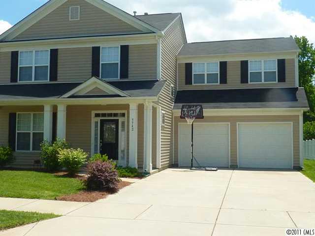 9942 Caldwell Depot Road Cornelius, NC 28031 - Photo 1 of 9 a front view of a house with garden