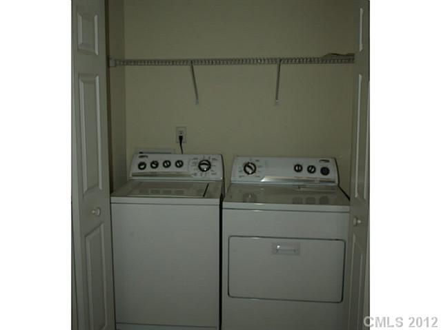 9942 Caldwell Depot Road Cornelius, NC 28031 - Photo 7 of 9 a utility room with dryer and washer