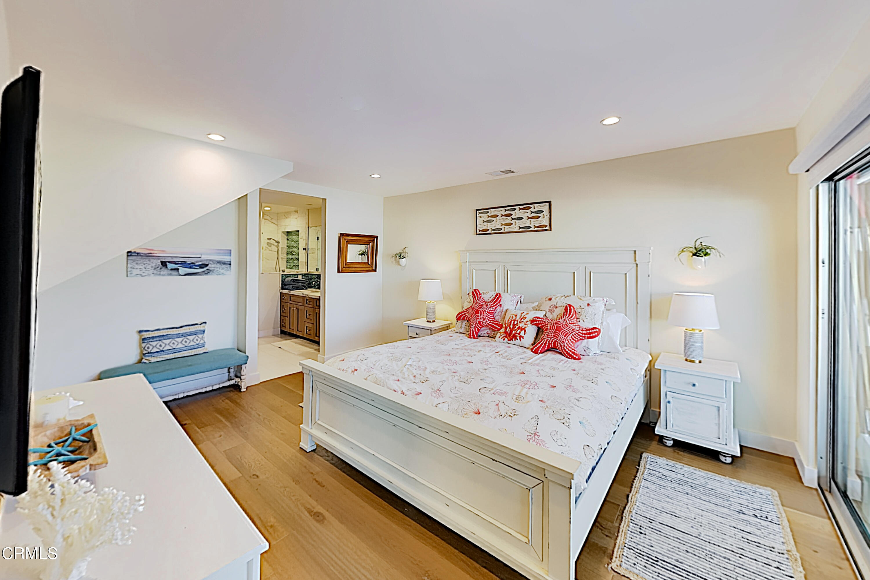 4531 Costa De Oro Oxnard, CA 93035 - Photo 11 of 26 a bedroom with a bed and wooden floor