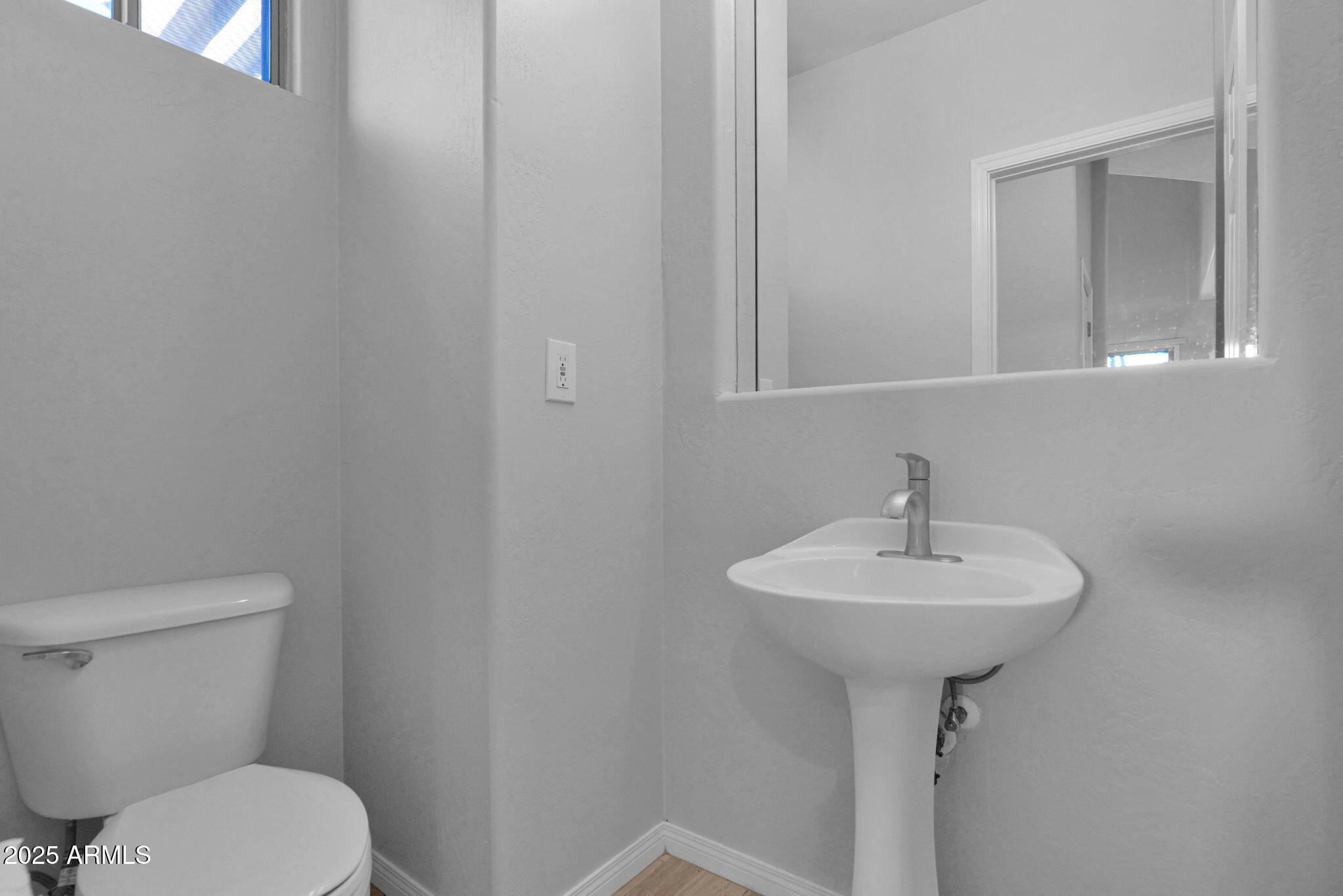 16420 North Thompson Peak Parkway, Unit 1057 Scottsdale, AZ 85260 - Photo 13 of 39 a bathroom with a sink a toilet and mirror