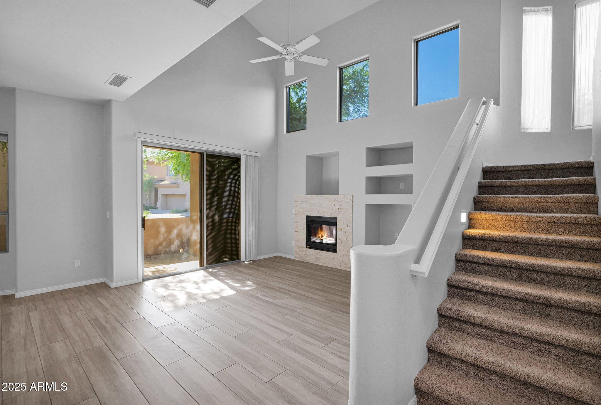 16420 North Thompson Peak Parkway, Unit 1057 Scottsdale, AZ 85260 - Photo 14 of 39 a view of an entryway with wooden floor and a livingroom