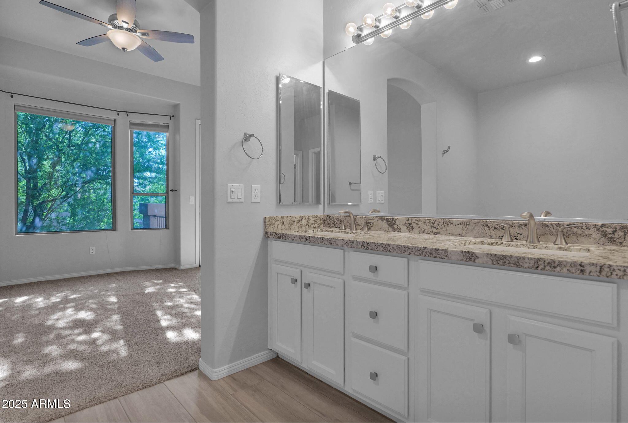 16420 North Thompson Peak Parkway, Unit 1057 Scottsdale, AZ 85260 - Photo 19 of 39 a bathroom with a granite countertop sink a vanity and a large mirror