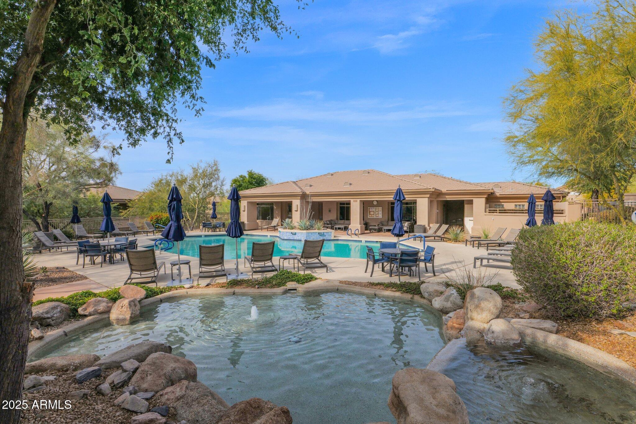 16420 North Thompson Peak Parkway, Unit 1057 Scottsdale, AZ 85260 - Photo 28 of 39 a front view of a house with outdoor seating
