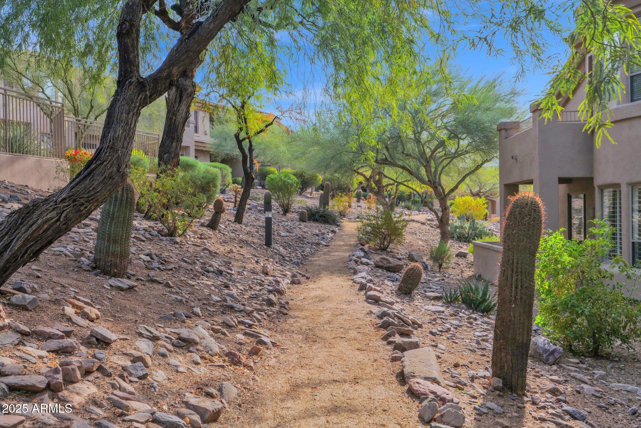 16420 North Thompson Peak Parkway, Unit 1057 Scottsdale, AZ 85260 - Photo 29 of 39 a backyard of a house with lots of green space