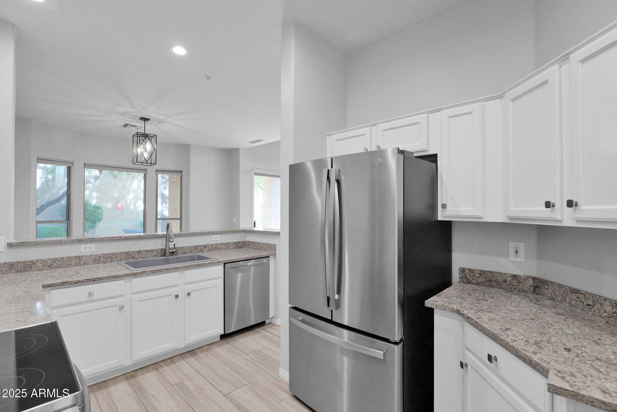 16420 North Thompson Peak Parkway, Unit 1057 Scottsdale, AZ 85260 - Photo 8 of 39 a kitchen with a refrigerator sink and cabinets
