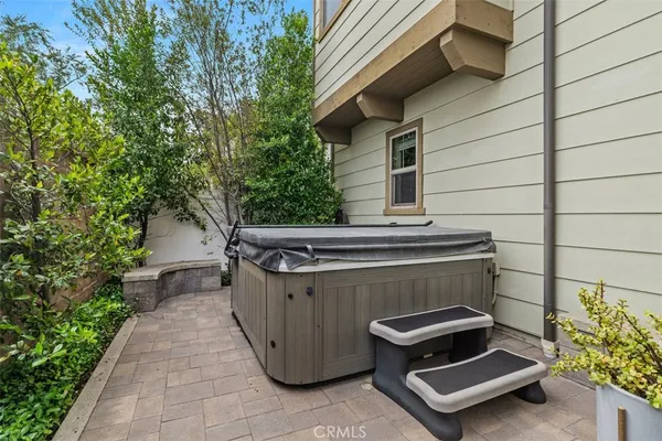 a view of a terrace with a table and chairs
