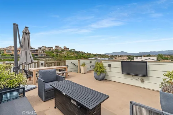 a view of a town with mountains in the background