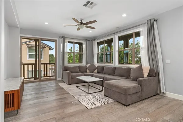 a living room with furniture and a large window