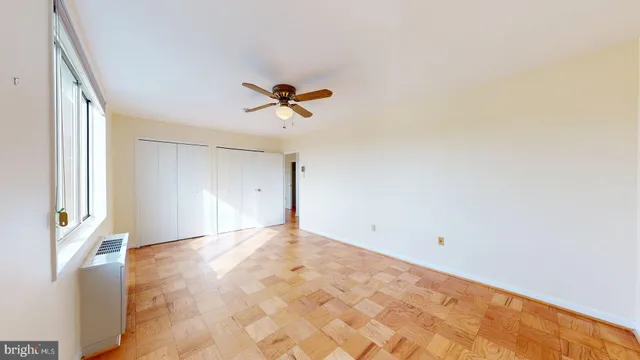 a view of a room with a empty space and wooden floor