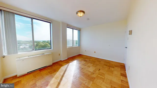 a view of a big room with windows